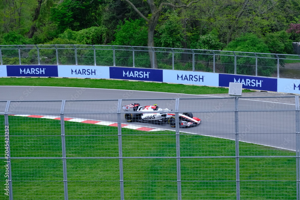 Obraz premium May 24, 2026, Montreal, Canada - Haas Formula 1 car on track by Ocon and Bearman at Circuit Gilles Villeneuve. g.