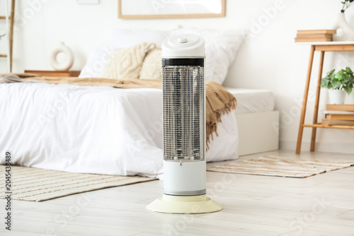 Electric heater on floor in...