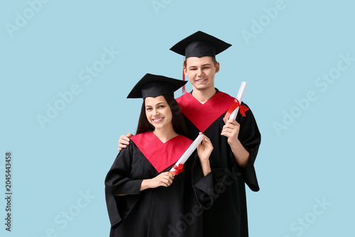 Happy graduate couple with ...