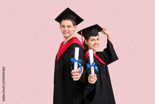 Happy graduate couple with ...