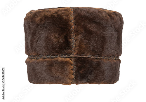 Traditional brown fur hat with intricate stitching isolated white background
