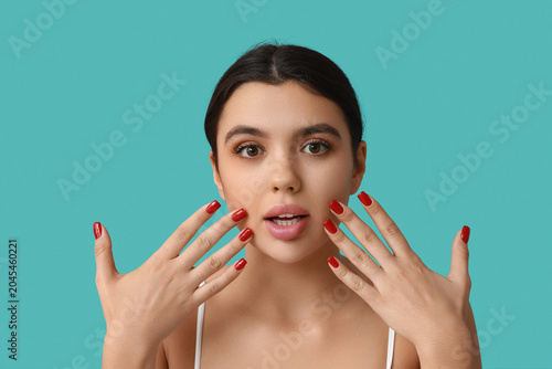 Surprised young woman with ...