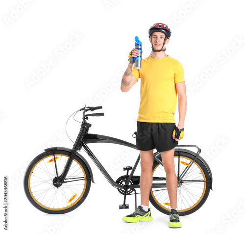 Young man with modern bicyc...