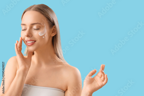 Pretty young woman with cre...