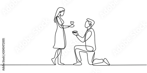 Tableau sur toile Man kneeling and proposing to woman with heart shaped ring box proposal man prop