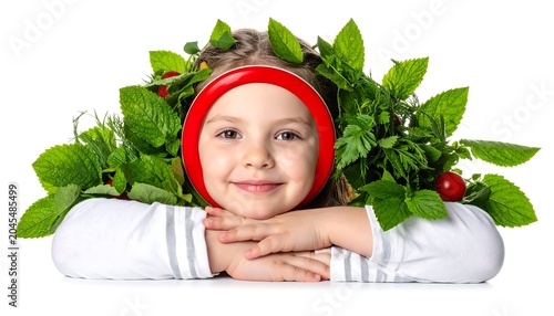 A smiling child, framed by green leaves and a red band, rests arms on a surface against a white background