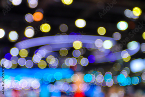 colorful bokeh lights at an exhibition hall. got those cool blue and yellow blurry circles with some glowing lines abstract background