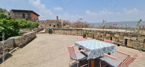 Outdoor Rooftop Sitting Area with Table and Chairs at the Historic Dadhikar Fort in Alwar Rajasthan India