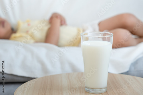 Konstfotografi Milk allergens, children felling stomachache and diarrhea , runny stuffy sore nose suffer from intolerance allergy trigger symptoms