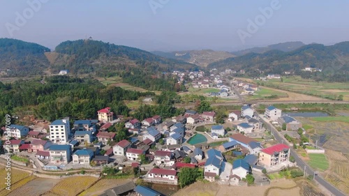 Aerial View of Rural Village and Farmland in Countryside Hills