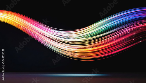 Wavy rainbow light streaks with sparkling particles on black background