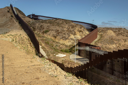 Εκτύπωση καμβά Looking down at the international border wall from Tijuana Mexico