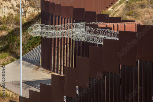 Obraz na płótnie Looking down at the international boarder wall from Tijuana Mexico