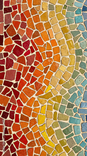 Colorful mosaic tile pattern with gradient from red to blue, artistic abstract texture, handmade tile design, decorative background, modern wall or floor concept.