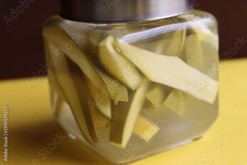 Authentic Green Mango in Salted Brine, Pickled Slices, Traditional Indian Uppilittathu or Kadumango
