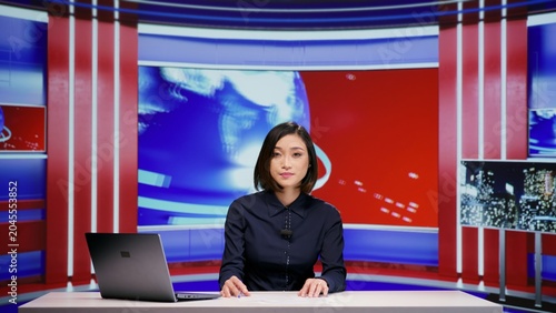 Foto Media broadcaster talks about latest events on tv program, covering all topics in news studio