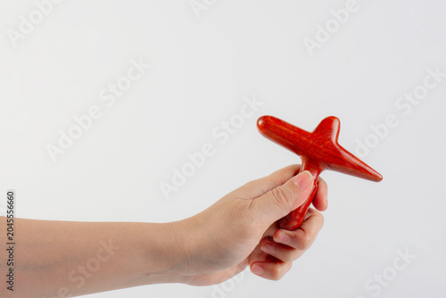 Massage stick and hand on a white background