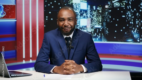 Obraz na plátně Television host starting late night show to present global news and new events, live broadcast studio