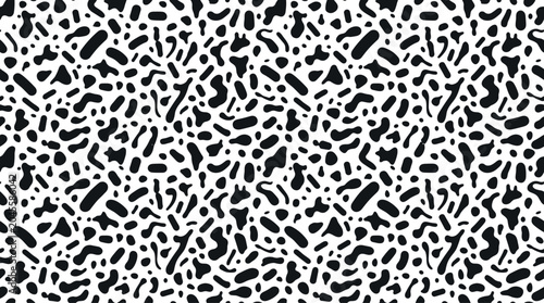 Seamless pattern featuring random black organic shapes and dots on a white background, for textile and, wallpaper print