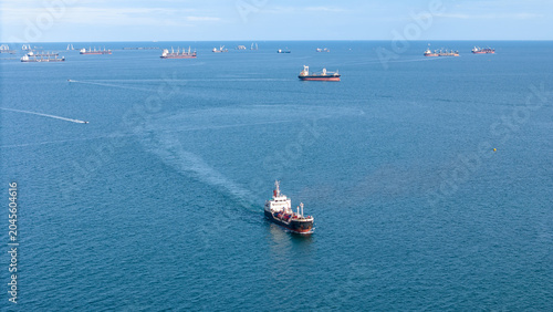 Cuadro en lienzo fast patrol boat with LPG gas and oil tanker ships anchored in the ocean, with a fast patrol boat in the foreground