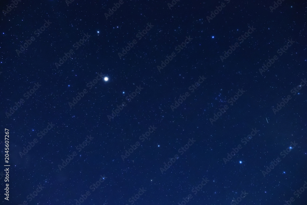 Obraz premium Constellations and Milky Way stars on a dark countryside skies.