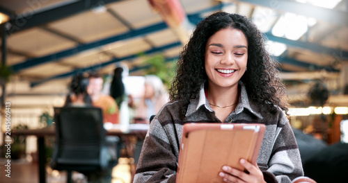Fotografie Student, research and happy woman with tablet in university study for education or learning