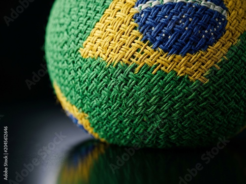 Close-up of a Woven Ball Featuring the Brazilian Flag Colors and Texture