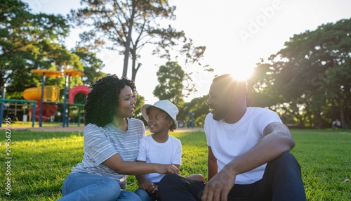 Parents chatting while children play in public playground