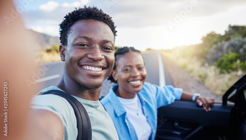 Young people taking selfies during a road trip adventure, realistic travel friendship