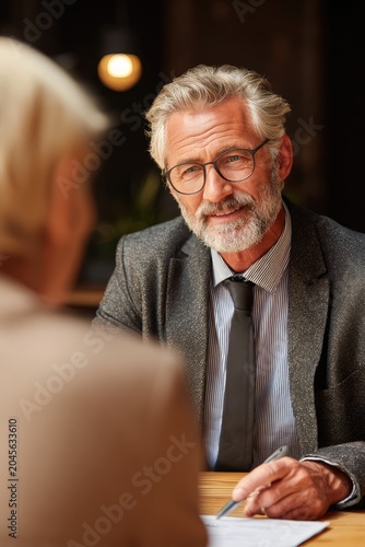 Engaging Business Conversation: Professional Man in a Meeting with Focused Attention