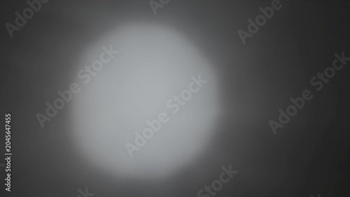 Round Haze Pulse That Grows Unevenly, Giving a Lopsided Glow