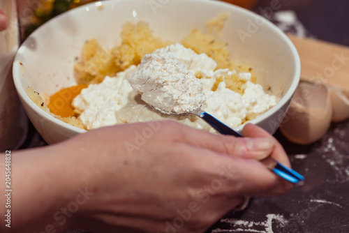 Hand Adding Flour to Riced Potatoes with Cottage Cheese Egg and Gnocchi Board