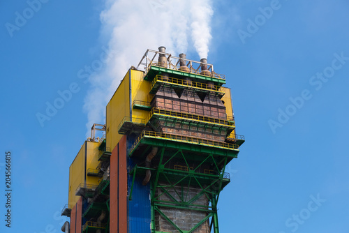 Industrial Power Plant with Steam Emissions and Blue Sky