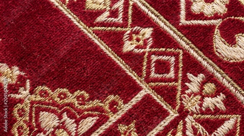 Close-up Abstract Geometric Moroccan Ornament Pattern in Deep Red and Gold