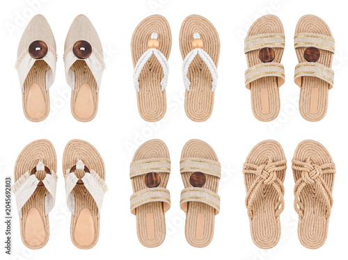 Cuadro en lienzo Overhead shot of a chic assortment of women's natural-toned summer sandals and flip-flops with stylish details
