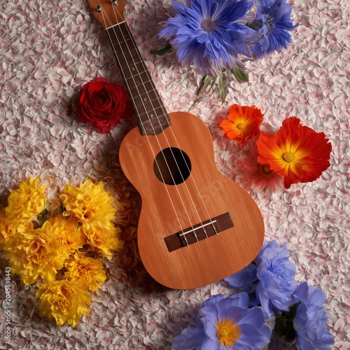 Flowers and a Ukulele on a Pink Flower Background in a Creative Arrangement