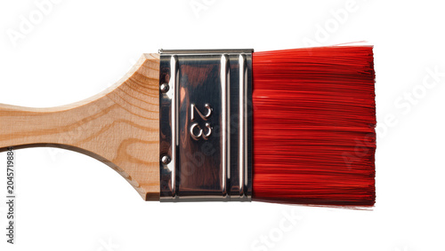 Foto Paint brush with red bristles and wooden handle