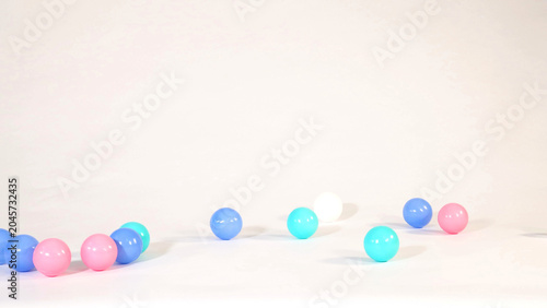 Bilde på lerret Colorful Plastic Balls Scattered Across a Clean White Studio Surface