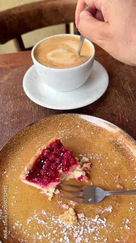 Eating cake and drinking coffee vertical
