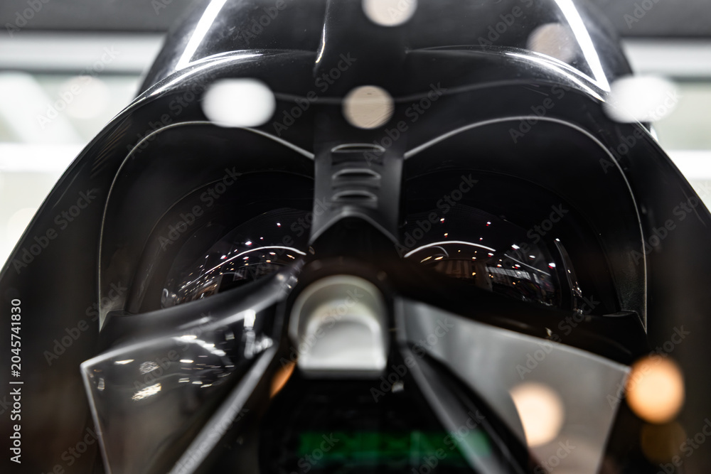 Naklejka premium Darth Vader black helmet macro view with light reflections in mask lenses