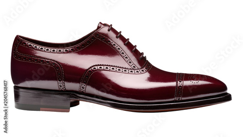 Photos Glossy burgundy leather oxford brogue shoe with decorative perforations, isolate