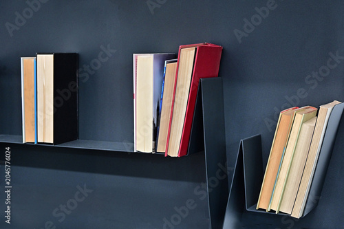 creative composition of books arrranged on shelves