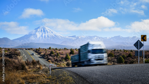 High speed truck travelling on Desert Road. Mount Ngauruhoe in the distance. State Highway 1. North Island.