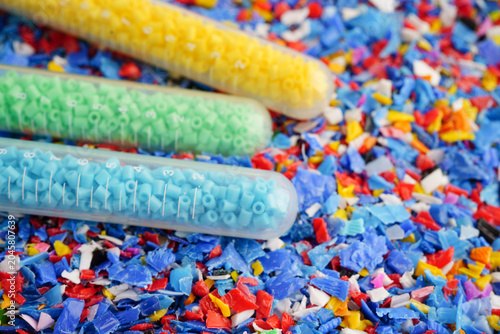 Fotografija Plastic colorful pieces recycling shredded for industrial use.