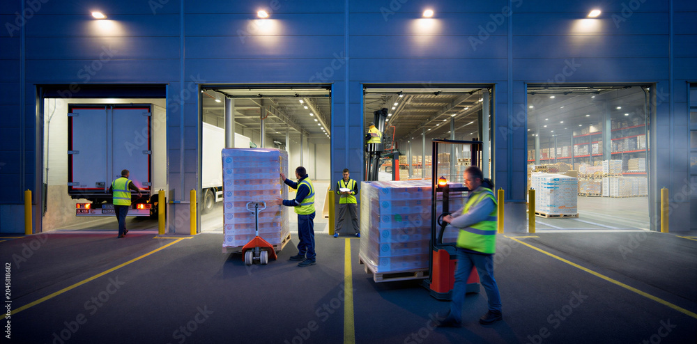 Fototapeta premium Warehouse shipping loading dock workers loading boxes onto truck for distribution and transport with warehouse logistics distribution shipping transport packages fulfillment delivery
