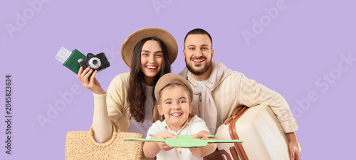 Family of travelers with su...