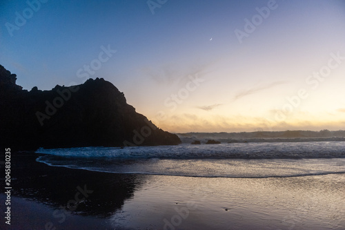 Photography Rocks in the surf of Pfeiffer beach, around sunset