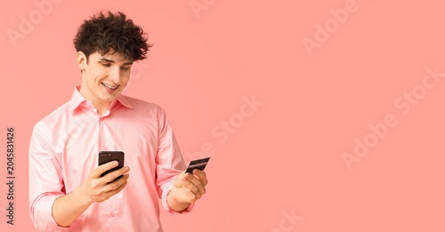 smiling young man in pink s...
