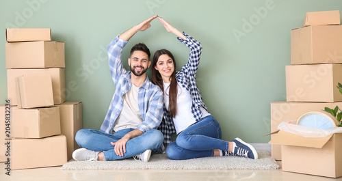 Young couple with belonging...