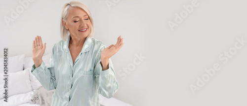 Happy mature woman dancing ...